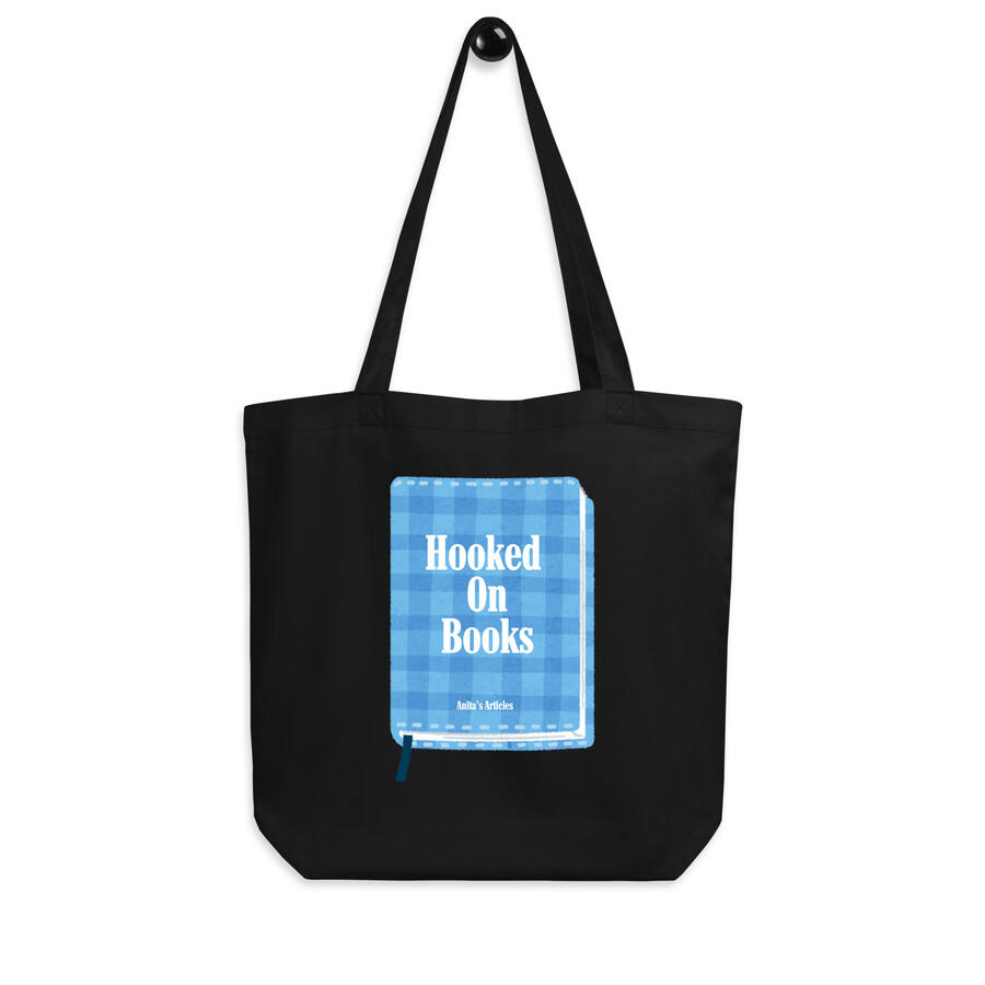 Image of black tote bag with blue gingham illustrated book with "Hooked on Books" as the title and "Anita's Articles" as the author